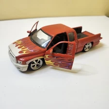 WELLY TRUCK 2002 Dodge Ram Quad Cab 1500 Sport Orange Purple Flames