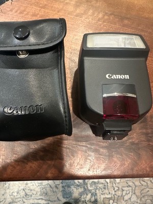 Canon Speedlite 220EX camera flash with its protective carrying case