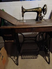 1912 Vintage Singer Sewing Machine on a wood & Cast iron desk