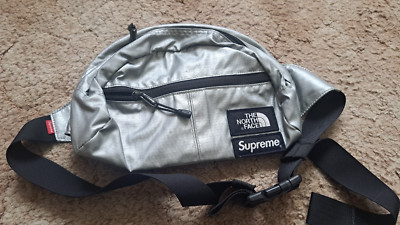 SUPREME X THE NORTH FACE METALLIC SILVER  ROO II LUMBAL PACK, SS18