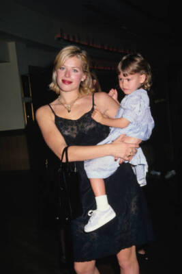 Amanda de Cadenet carrying her daughter Atlanta de Cadenet Taylor - Old Photo