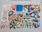 TMNT vintage accesories, parts and manuals lot, includes belts, weapons and more