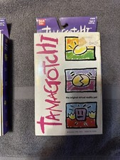 Bandai Tomagotchi 1996-1997 - (1800) Purple With Yellow Buttons