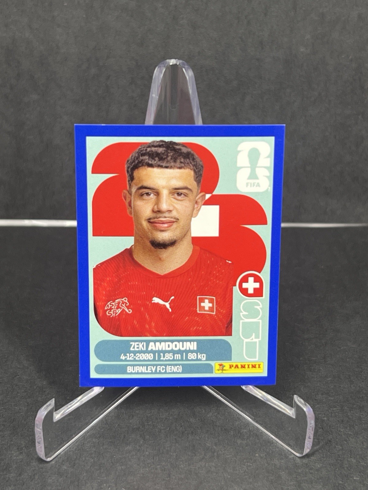 2026 Panini FIFA World Cup Zeki Amdouni Sticker Blue Parallel #SUI20