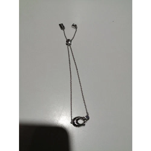 Bracciale COACH con logo C e strass