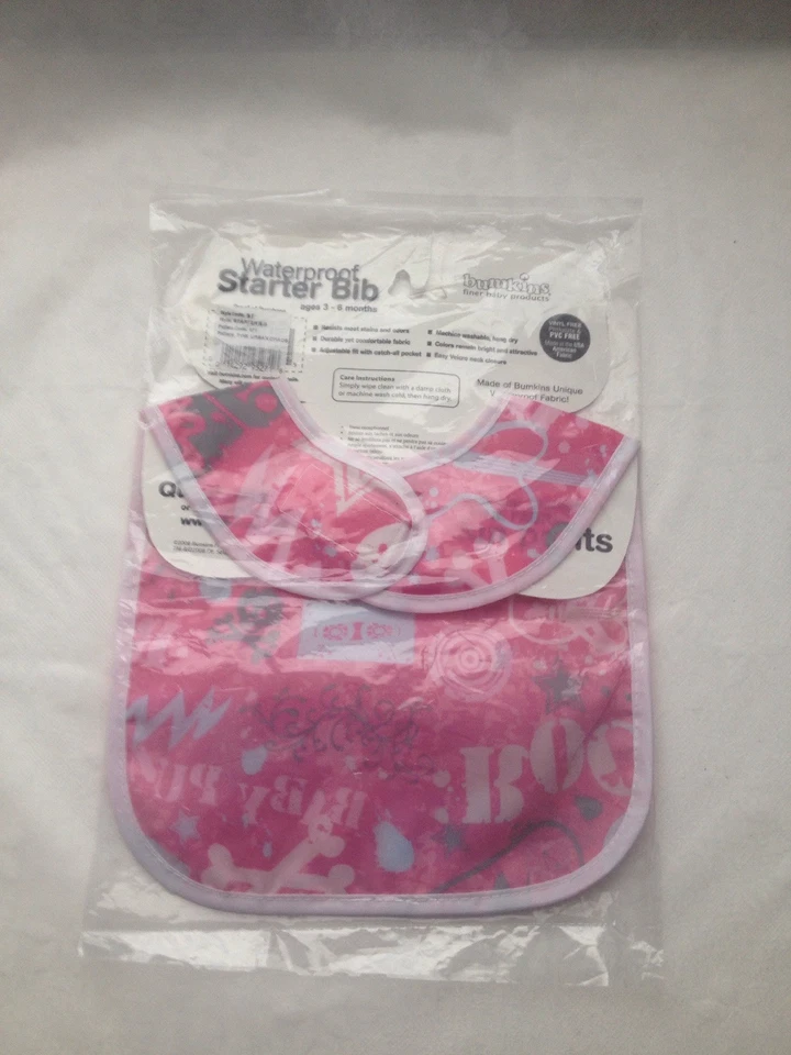 Babero de iniciación impermeable Bumkins rosa diseño caos urbano cierre a presión y palo Foto 2 de 4