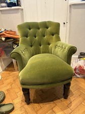 A Classic Deep Buttoned Velvet Fireside Armchair