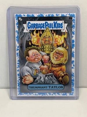 2023 Garbage Pail Kids Intergoolactic Mayhem #4a TRIUMPHANT TAYLOR Blue /99 - Bild 1 von 2