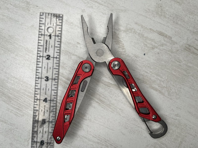 Basics 10-in-1 Stainless Steel Multitool Safety Lock with Nylon Sheath Red