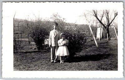 Vtg B&W Snapshot Boy in Suit And Girl in White Dress Formal Garden Yard 1950s