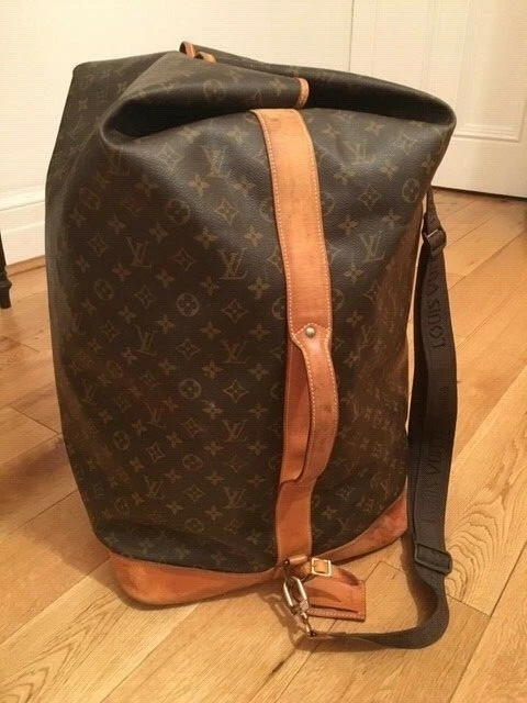 Lot - A Louis Vuitton leather and monogram canvas Sac Marin duffle, late  20th century