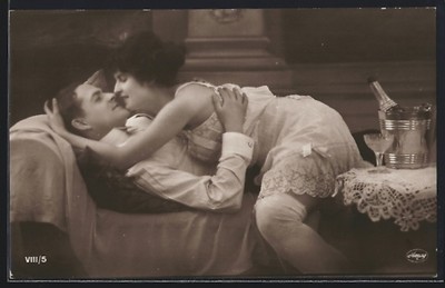 Photo postcard man and woman intimately on a chaise longue nude 