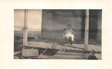 Vintage 1900's RPPC Child Sitting in Chair Western House