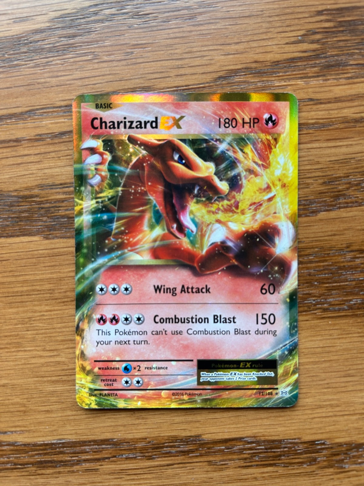 Charizard EX 12/108 Evolutions Holo 2016 (Good Centering, Slightly Played)