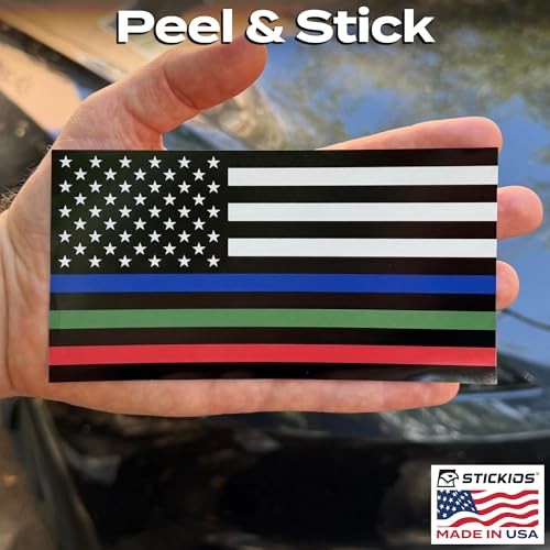 Hand holding a thin blue American flag sticker with white stars and green and red horizontal stripes, black border, Made in USA.
