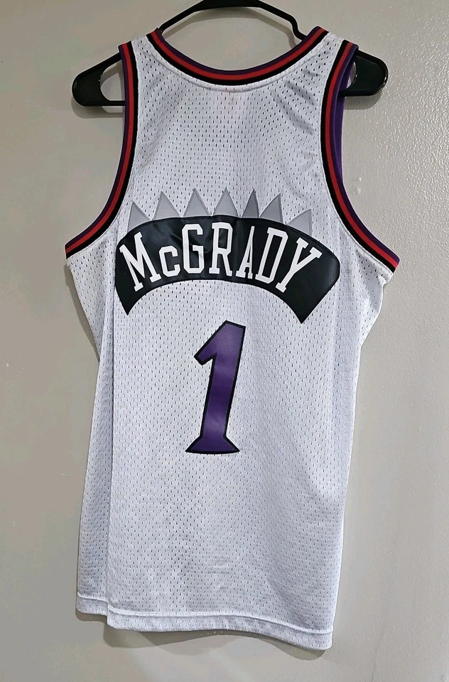 Camiseta deportiva Mitchell & Ness Swingman 1998-99 Tracy McGrady #1 Raptors para hombre platino Foto 2 de 4