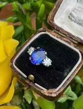 Anello di Fidanzamento 3,0 Ct Tanzanite e Moissanite Tre Pietre Oro Bianco 14k Massiccio