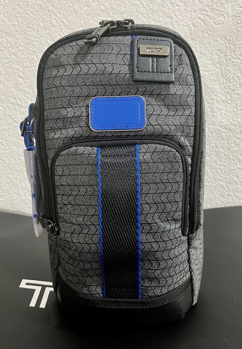 NWT Tumi FIFE Slim Sling Bag Charcoal With Chevron Blue Trim NWT Tumi FIFE Slim Sling Bag Charcoal With Chevron Blue Trim