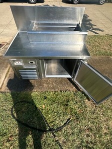 Reach in cooler, with working cold rail. Under 1 year old.