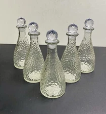 Set Of 5 GREENBRIER INTERNATIONAL Clear Hammered Bottles With Stoppers 7.0”