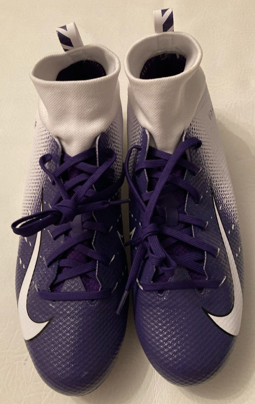 purple and white football cleats