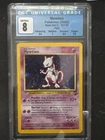 Pokemon Mewtwo 010/130 Base Set 2 Holo CGC 7
