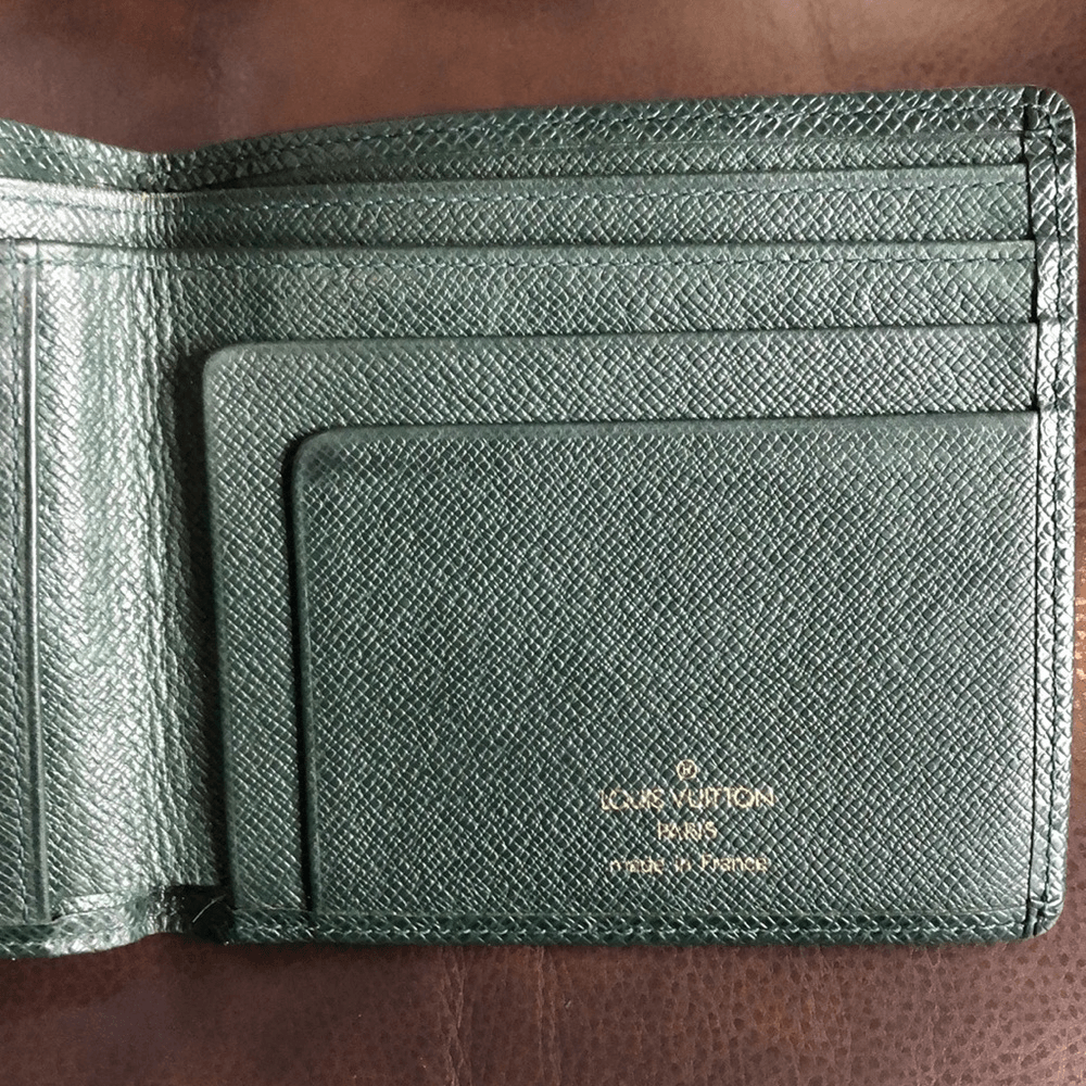 authenticity Guaranteed - Louis Vuitton Taiga Bifold Wallet: Vi0012