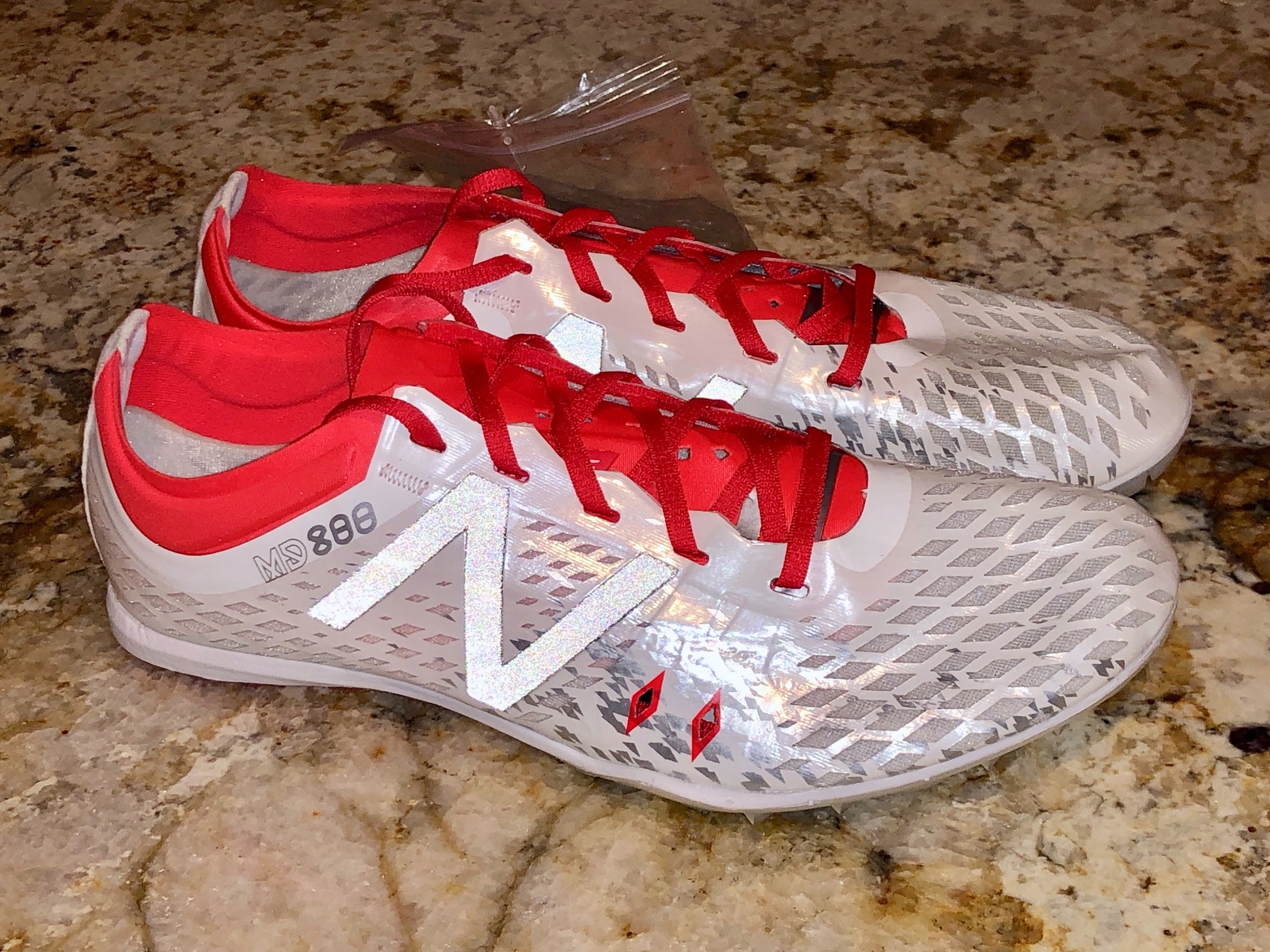 new balance mid distance spikes