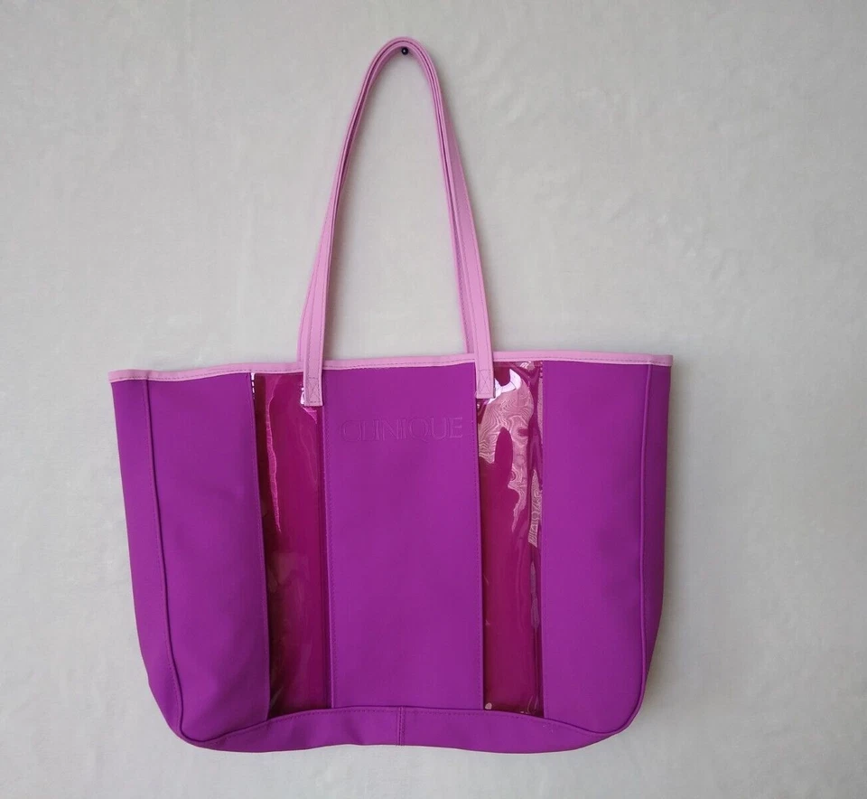 Bolso de Mano Clinique Púrpura con Asas de Vinilo Elegante Transparente Ver a Través 13.5" x 10" x 2".. Foto 2 de 4