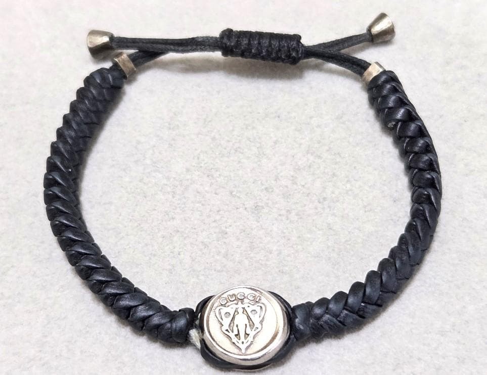 GUCCI Pulsera de Cuero Trenzado con Emblema de Cresta 42794