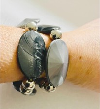 A Set Of Two Matching Grey And Silver Bracelets