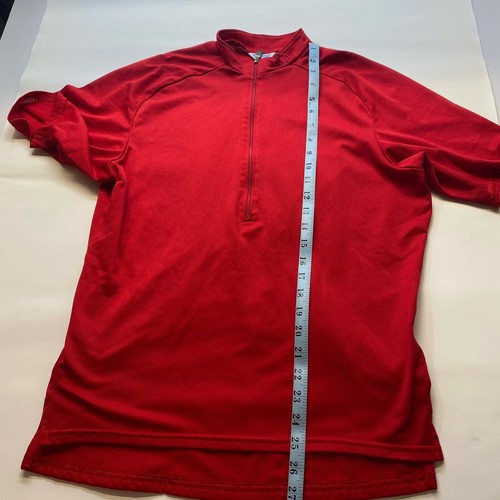 Red mesh Izumi men’s cycling shirt, small size, with vertical white panel, made in USA, half zip closure.
