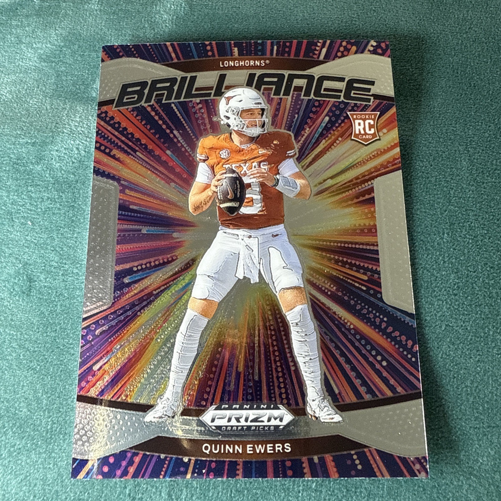 2025 Panini Prizm Draft Picks #15 - Quinn Ewers Brilliance Insert Rookie Logo