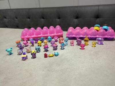 Hatchimals Collectibles rosa & lila Eierbehälter 2 Behälter und 34 Figuren