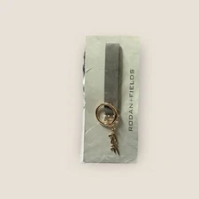 Rodan + Fields Grey Wrist Strap Keychain Accessory With Gold-Tone Charm