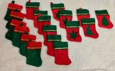 Lot of 18 small red and green Christmas stockings with 1 snowflake one