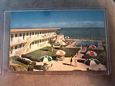 VTG MIAMI FLORIDA POSTCARD CARIB MOTEL-OCEAN AT 189TH ST IN HARD PLASTIC SLEEVE
