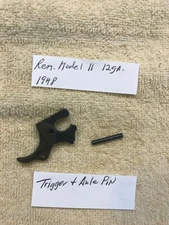 Remington Mod 11 12ga gun parts; Trigger and axle pin.