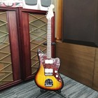 Squier Vintage Modified Jazzmaster with gold hardware, amber sunburst body, and three pickups, safe delivery from Japan.