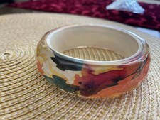 Women&rsquo;s Wide, Faceted Multicolor Lucite Bangle bracelet.