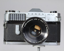 CANON CANONFLEX RM W 50MM 1.8 CANOMATIC LENS AND 1/2 CASE FOR PARTS OR REPAIR