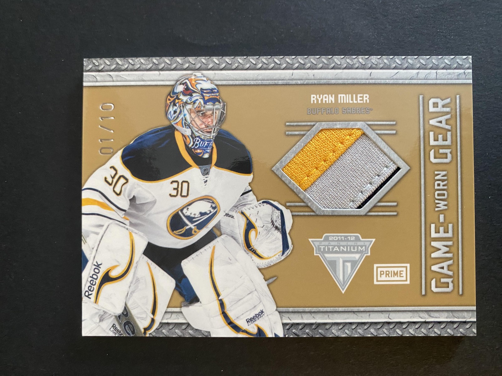 2011-12 Panini Titanium #23 Ryan Miller Game Worn Gear Prime #/10