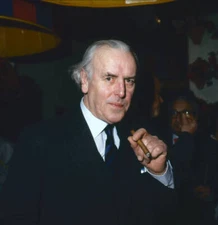 English actor George Cole a cigar in his hand at an unspecified ev- Old Photo