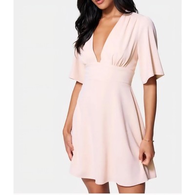 slim fit dress slacks Women Solid White V-Neck Sleeveless Front Twist Knot Cotton Pleated Fit & Flare  Mini Dress main image 0