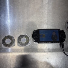 Sony PSP-1001 Console - Works - with 2 games and 1 family guy 