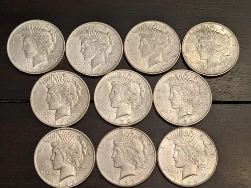Lot of 10 Peace Silver Dollars BU