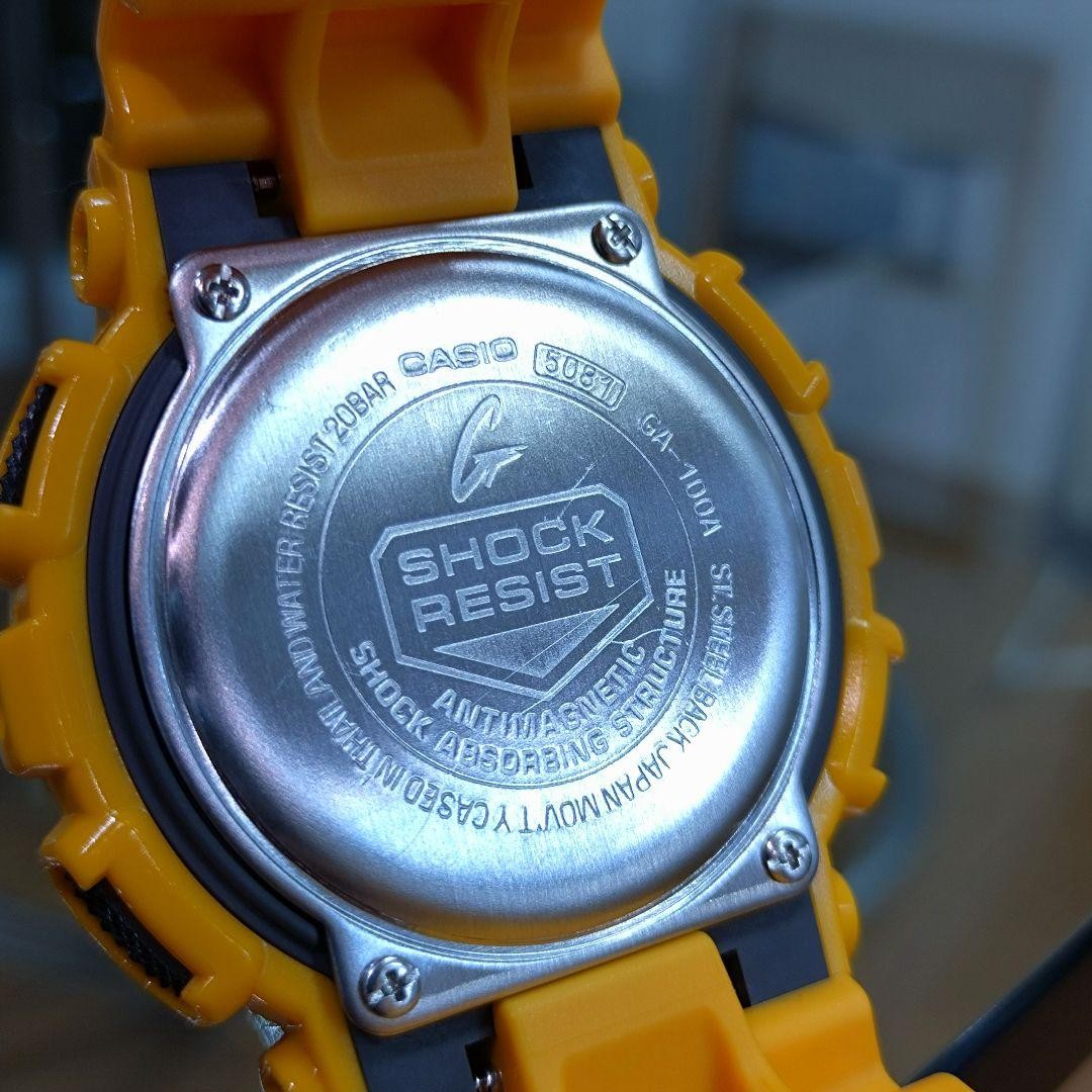 Casio G SHOCK GA 100A Yellow Digital Analog Hybrid Wristwatch