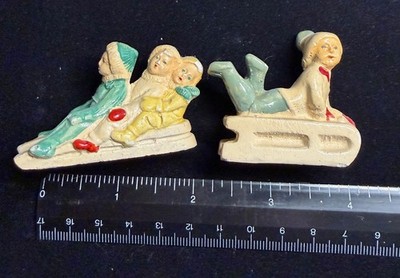 2 Vintage snow babies on sleds - some chips