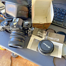 Nikon EM 35mm SLR Film Camera w/Nikon 50mm f/1.8 Lens Kit  Case Strap  Rokinon