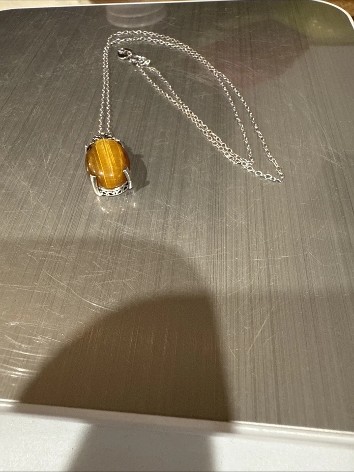 This is a silver 18” necklace with a tiger's eye like pendant. - Image 2 of 4